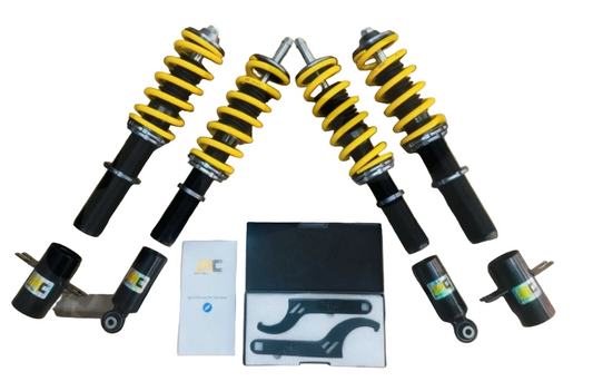 Set of car shock absorbers with tools on a white background